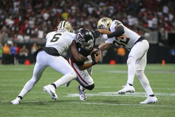New Orleans Saints safety Marcus Maye (6) strips the ball from Atlanta Falcons quarterback Marcus Mariota (1) as safety Tyrann Mathieu (32) looks to make a tackle. Mandatory Credit: Brett Davis-USA TODAY Sports